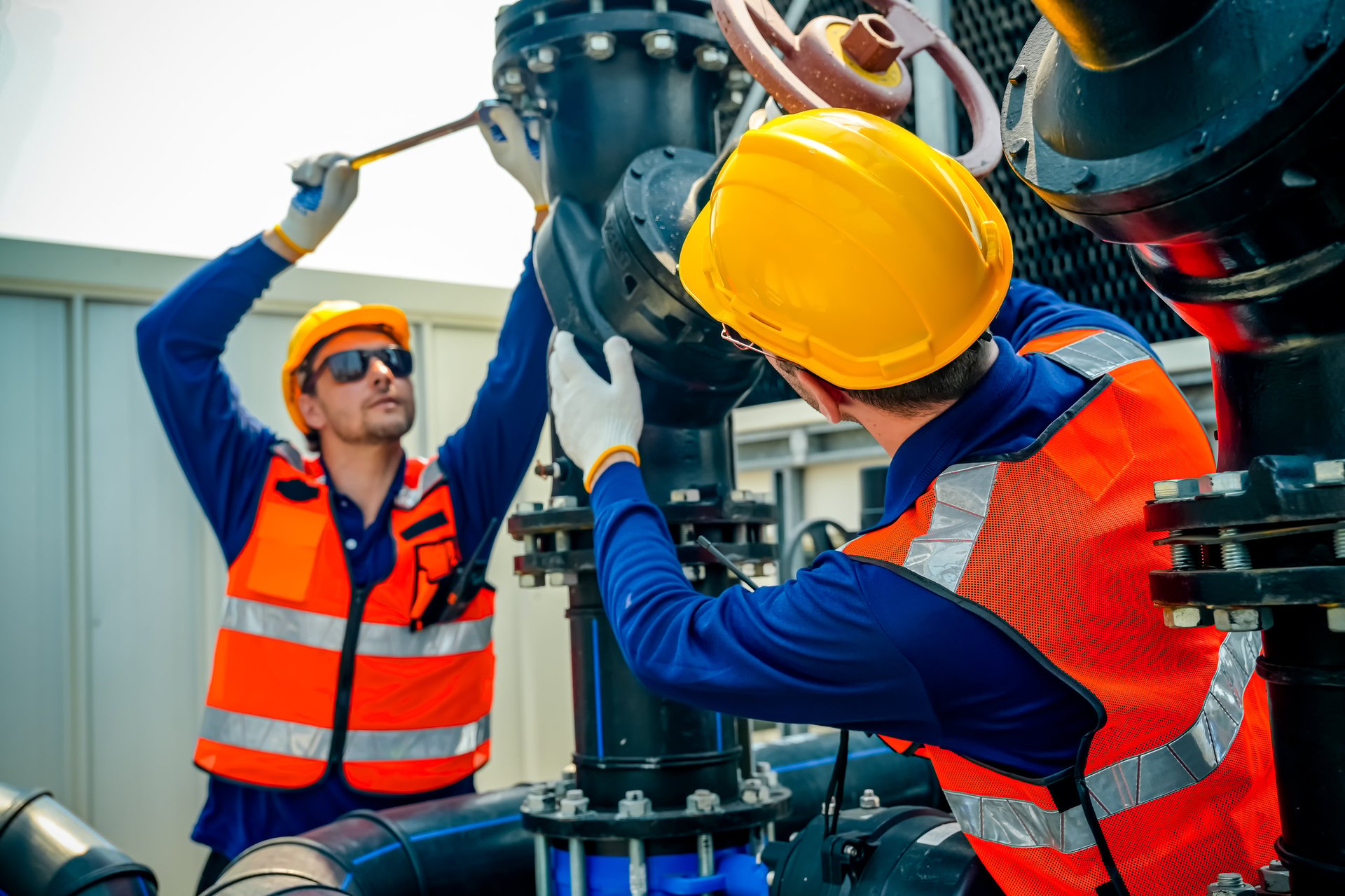 Commercial facility technicians coordinating maintenance work